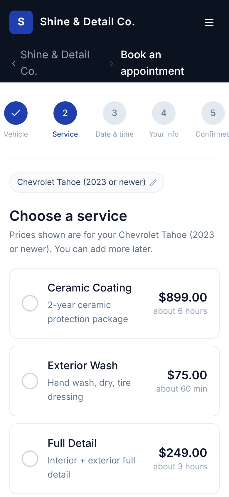 Booking step two on a phone: services priced for a Chevrolet Tahoe.